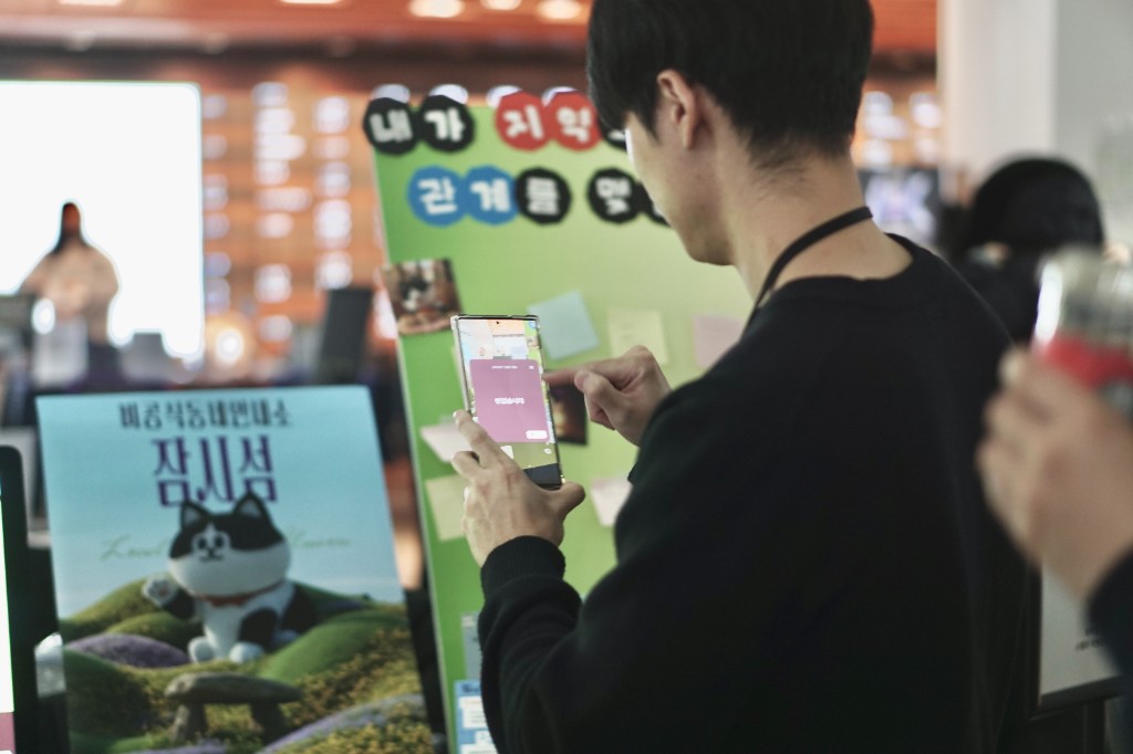 Visitor trying the Local Universe app at a project booth